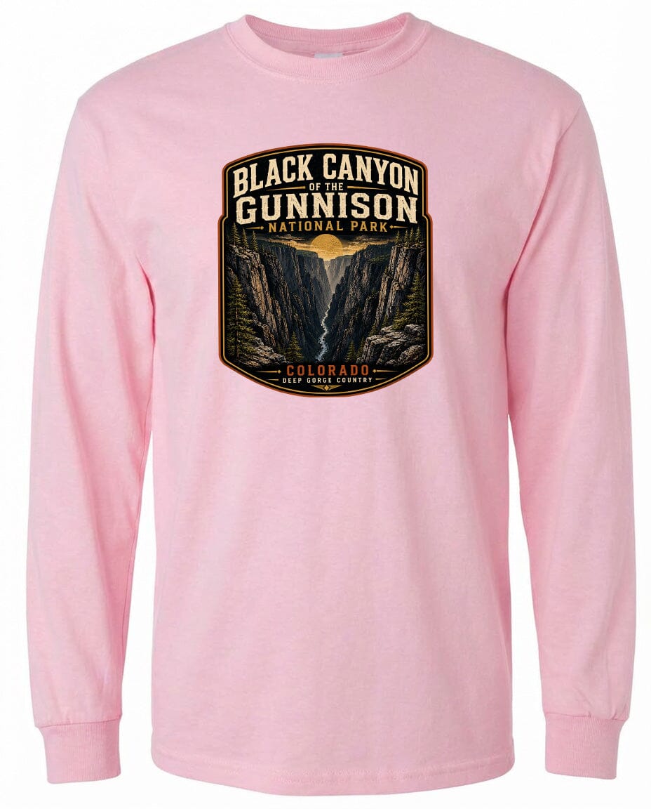 A pink long-sleeved t-shirt with a graphic design depicting the Black Canyon of the Gunnison National Park in Colorado.