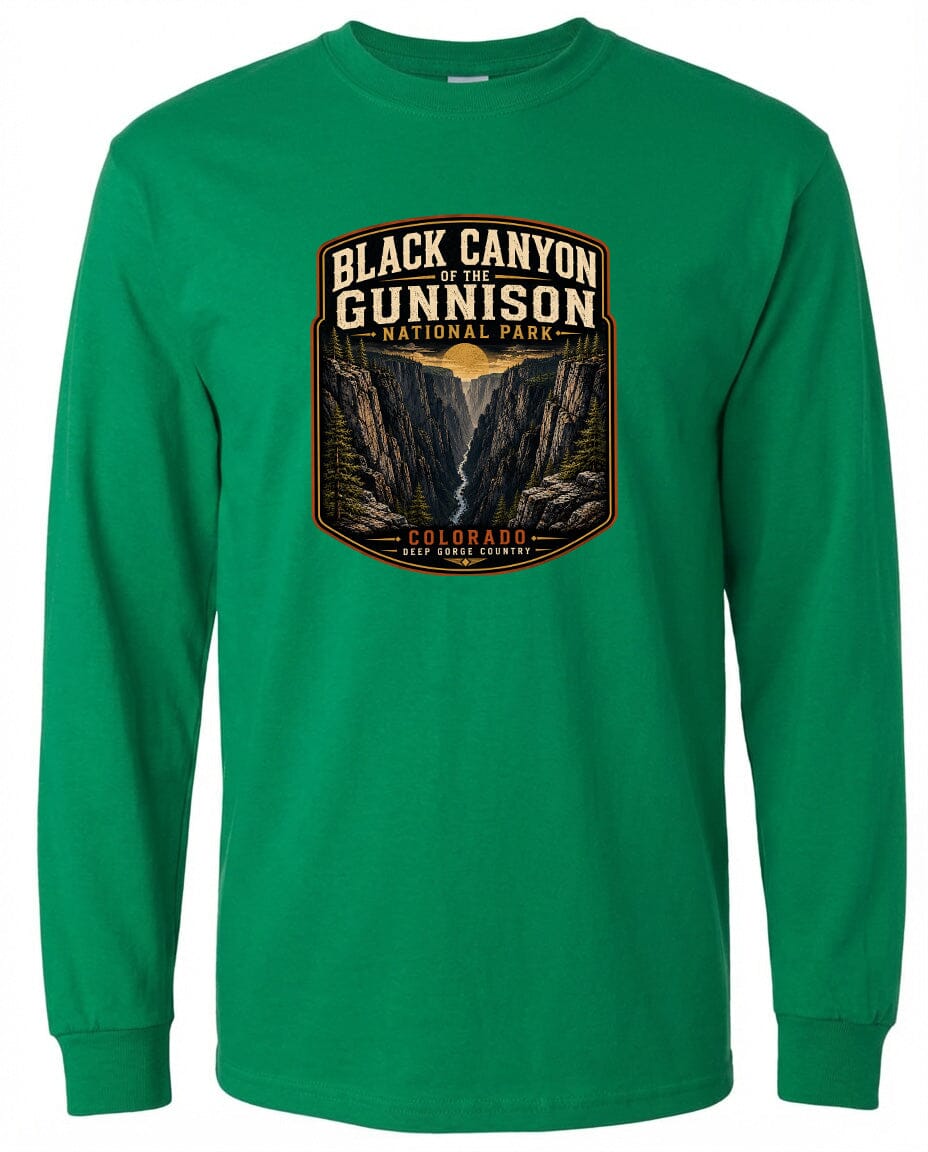 A green long-sleeved t-shirt with a graphic design depicting the Black Canyon of the Gunnison National Park in Colorado.