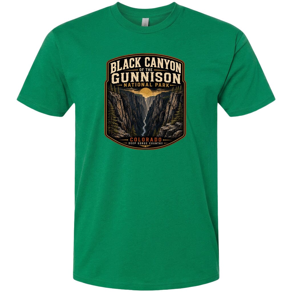 A green t-shirt with a graphic design depicting the Black Canyon of the Gunnison National Park in Colorado.