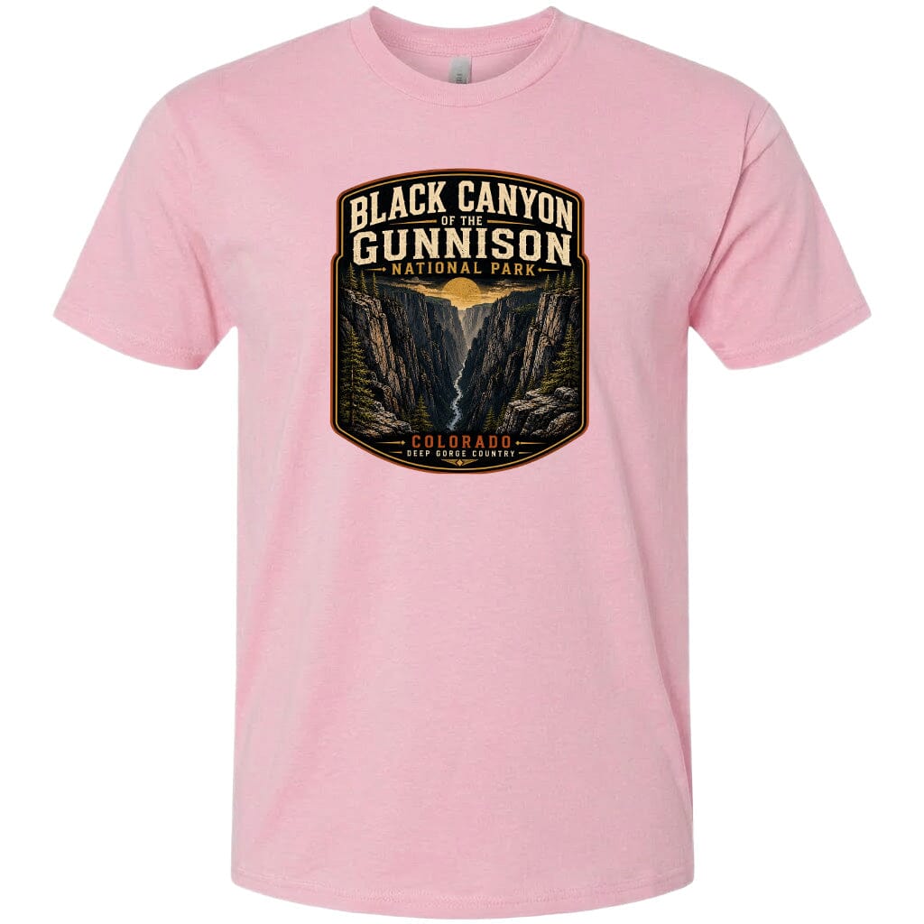 A pink t-shirt with a graphic design depicting the Black Canyon of the Gunnison National Park in Colorado.