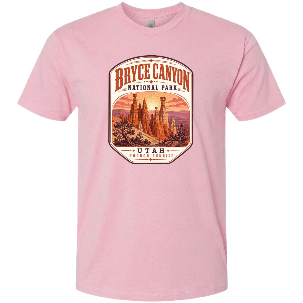 A pink t-shirt with a graphic design depicting the Bryce Canyon National Park in Utah.