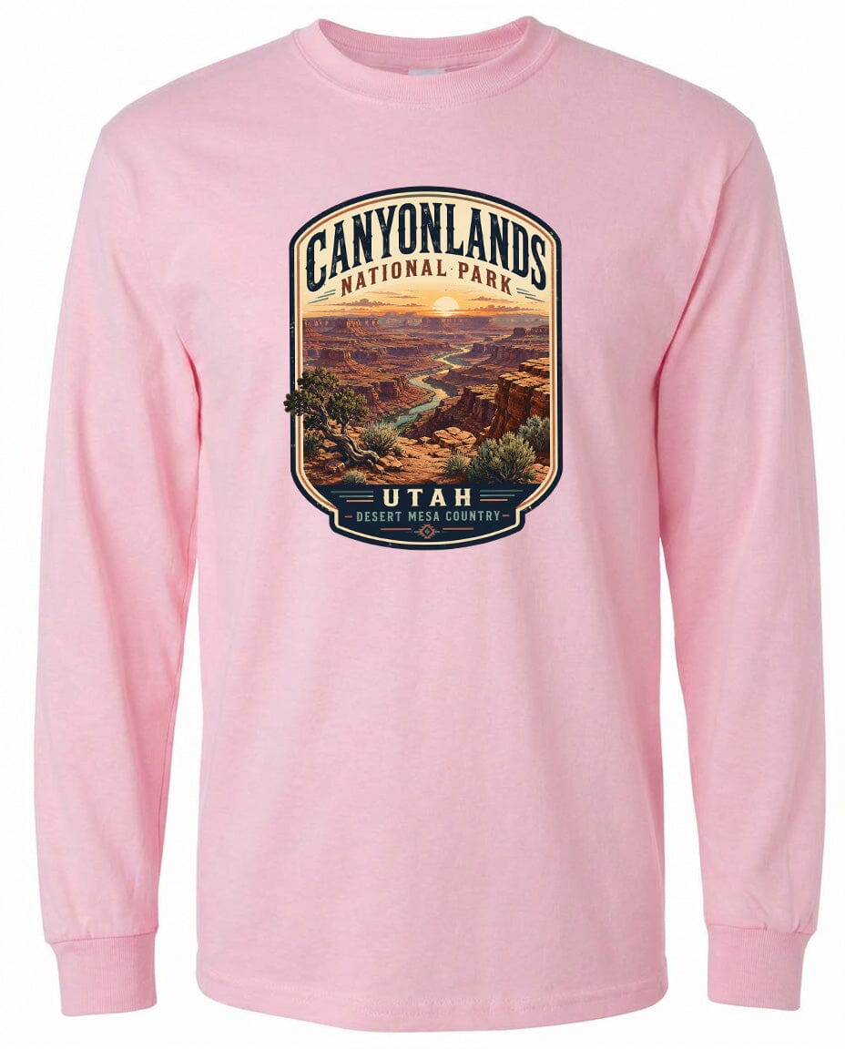 A pink long-sleeved t-shirt with a graphic design depicting the Canyonlands National Park in Utah, USA.