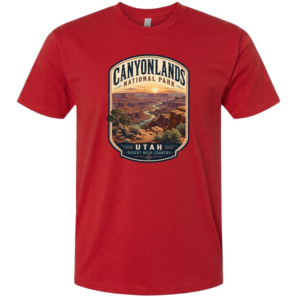 A red t-shirt with a graphic design depicting a scenic landscape of the Canyonlands National Park in Utah.