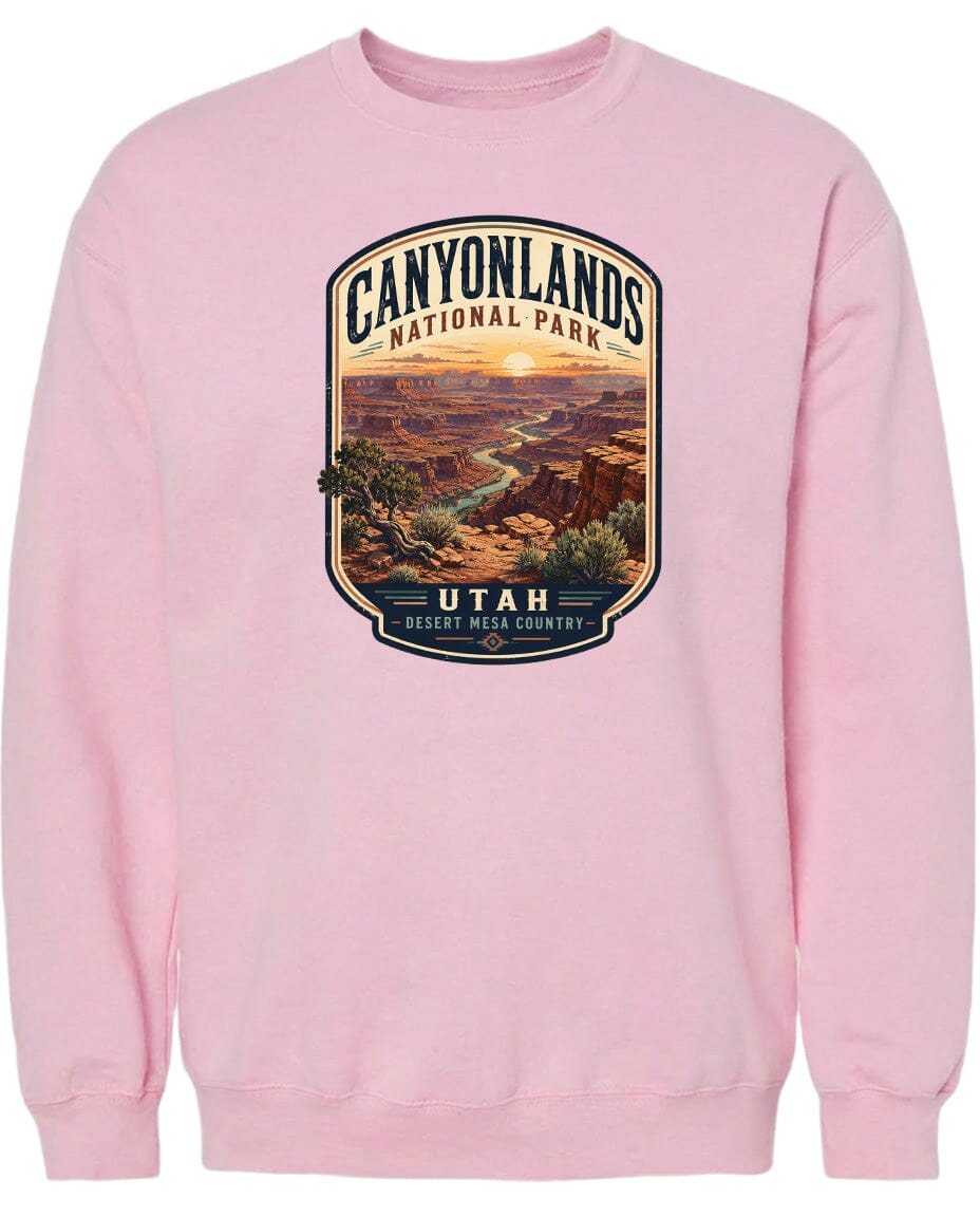 A pink sweatshirt with a graphic design depicting the Canyonlands National Park in Utah.