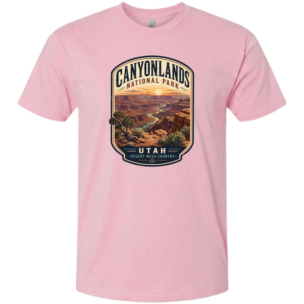 A pink t-shirt with a graphic design depicting the scenic landscape of Canyonlands National Park in Utah.