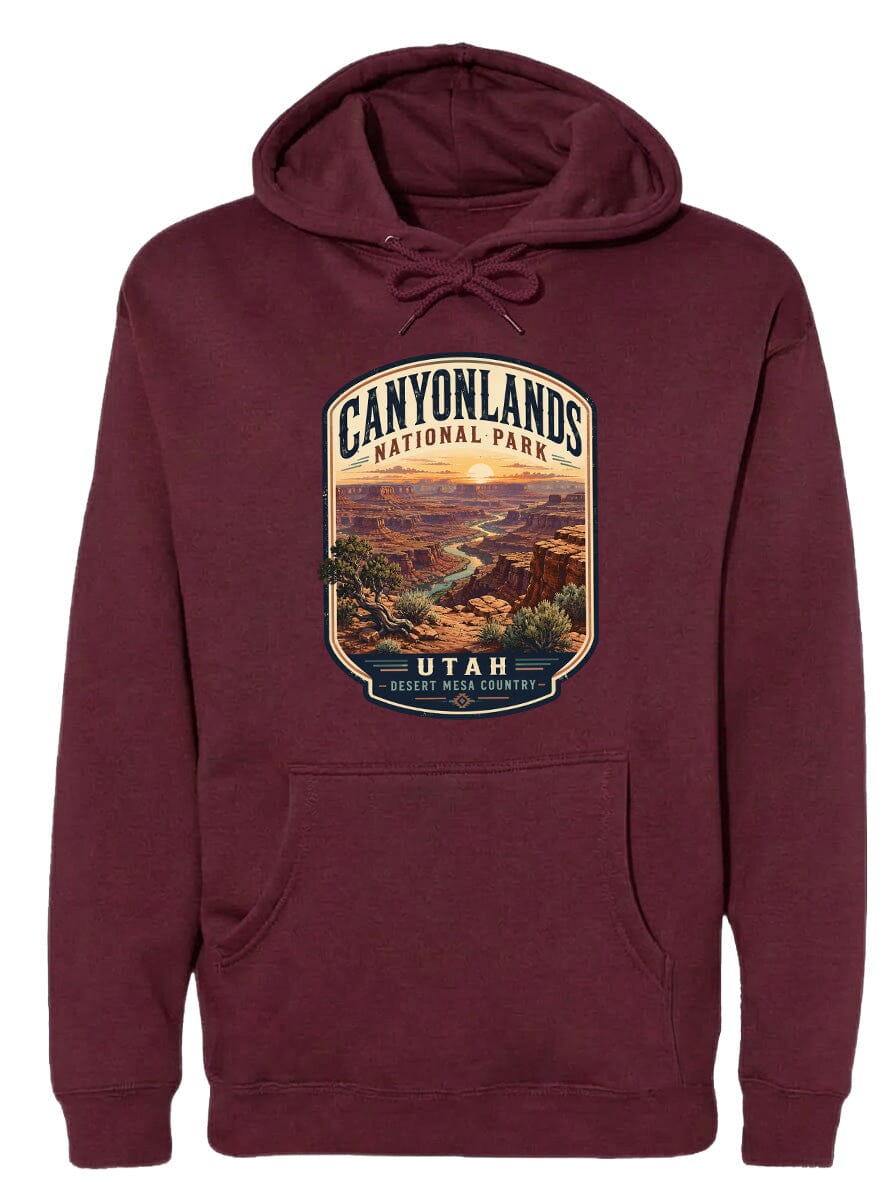 A burgundy hoodie with a graphic design depicting the scenic landscape of Canyonlands National Park in Utah.