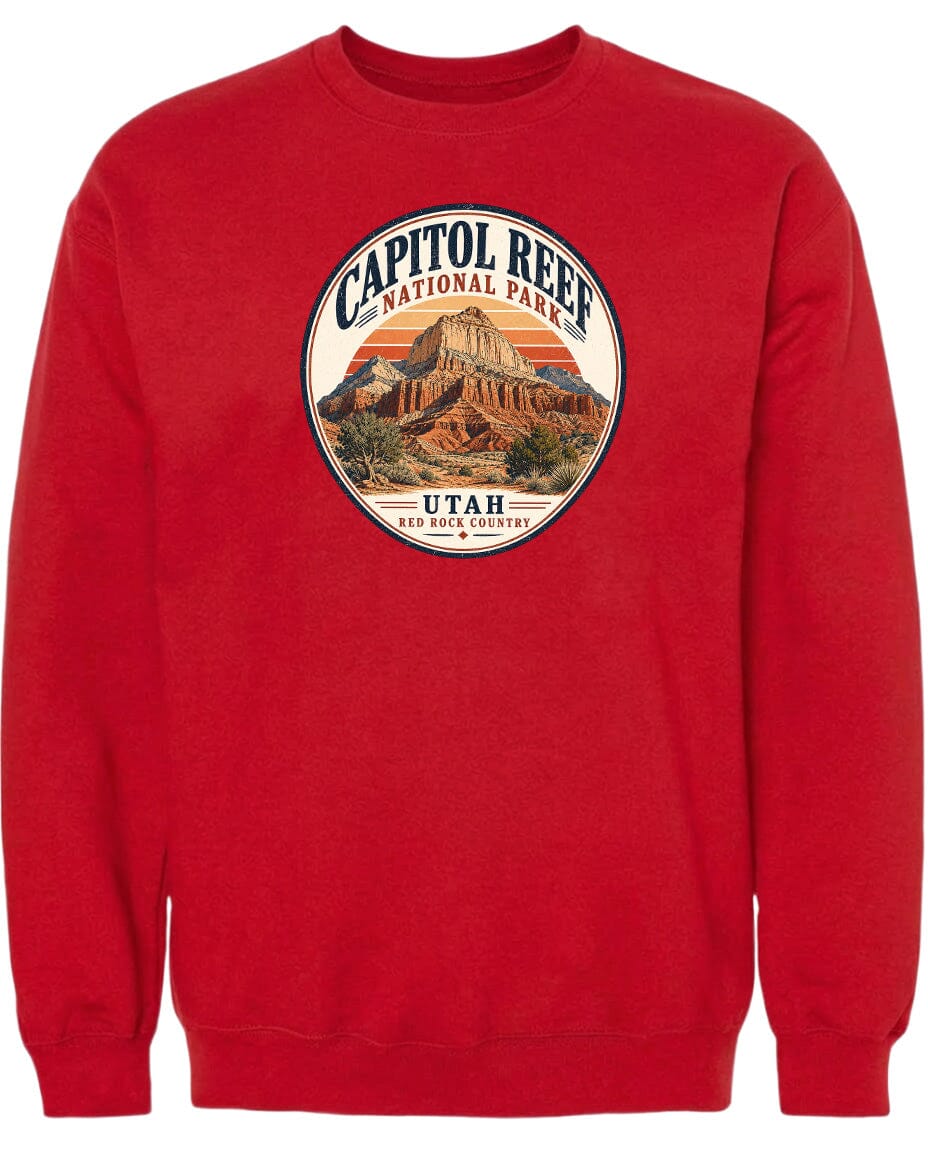 A red sweatshirt with a circular graphic design featuring a mountain and the text "CAPITOL REEF NATIONAL PARK UTAH ROCK COUNTRY".