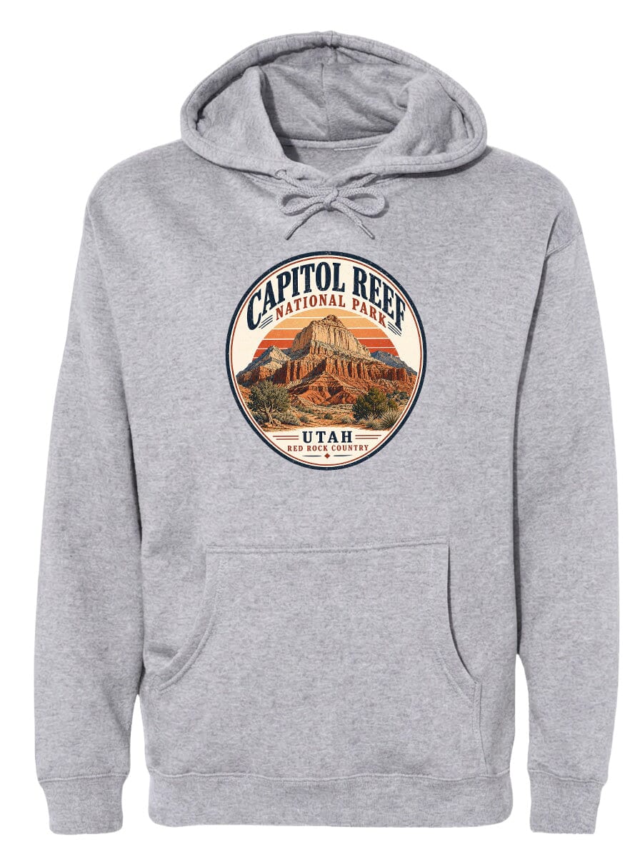 A gray hoodie with a circular design featuring the Capitol Reef National Park logo and a mountain landscape.