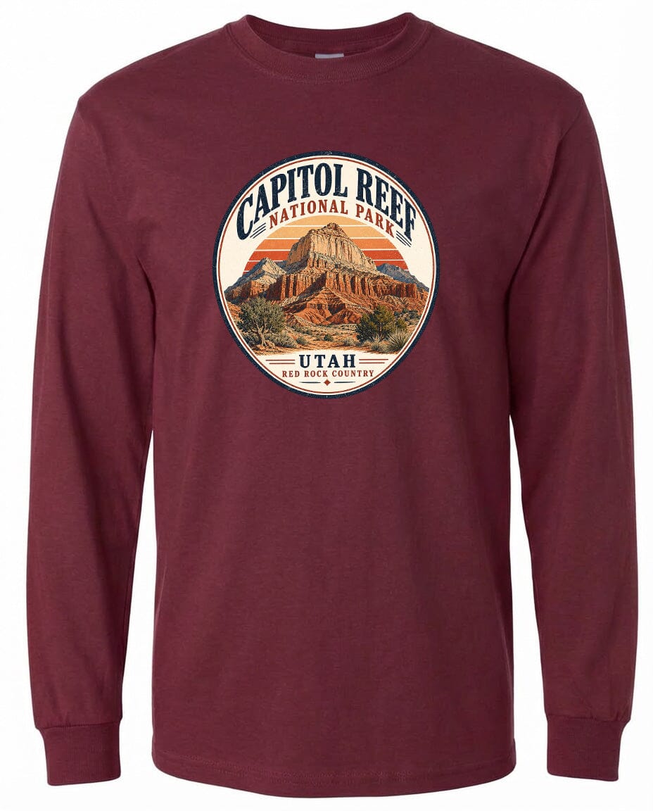 A long-sleeved burgundy t-shirt with a circular design featuring the Capitol Reef National Park in Utah.