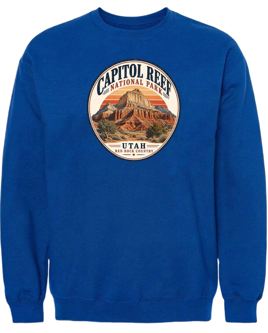 A blue sweatshirt with a circular graphic design featuring the Capitol Reef National Park in Utah.
