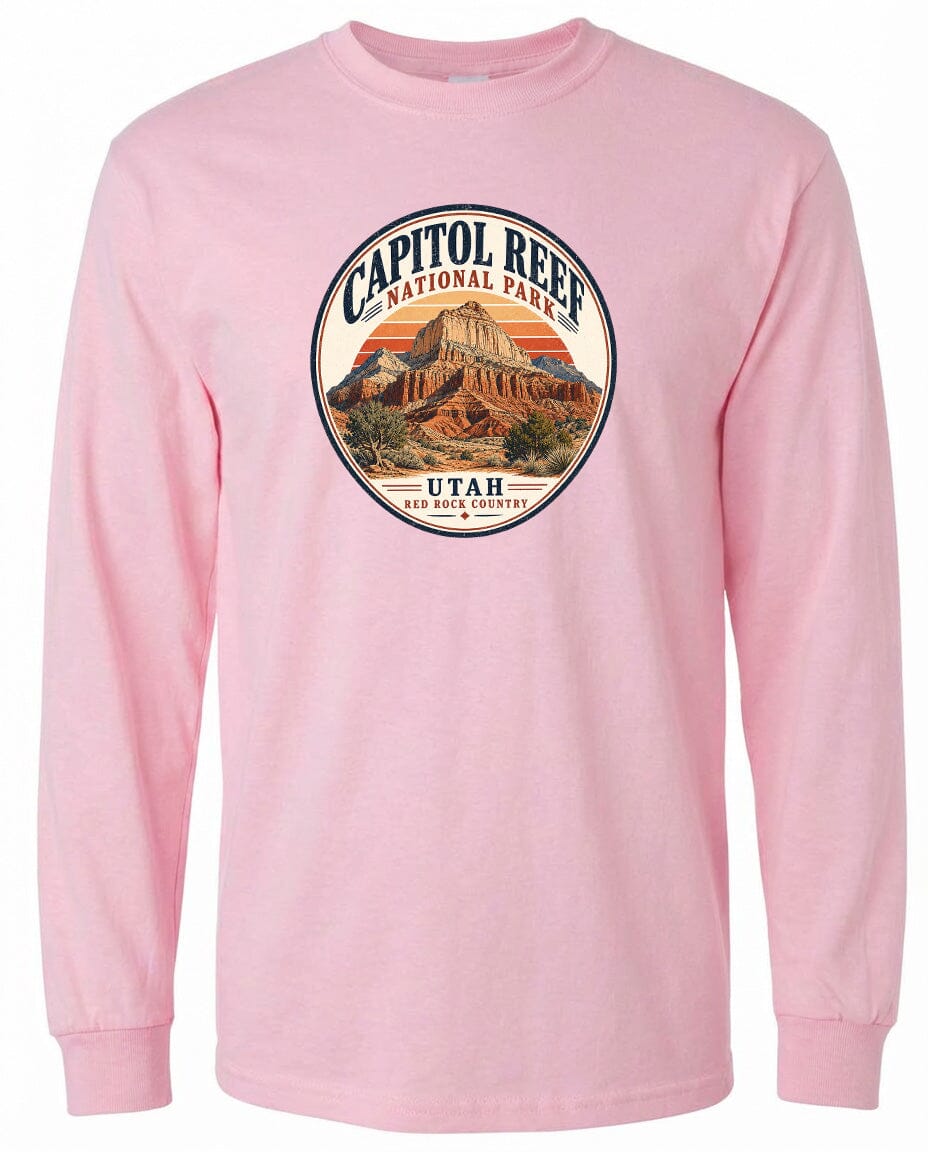 A pink long-sleeved t-shirt with a circular graphic design featuring the Capitol Reef National Park in Utah.