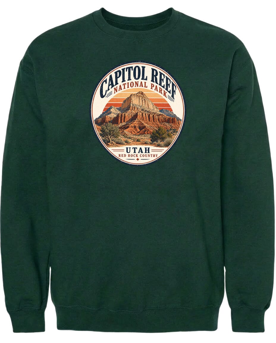 A green sweatshirt with a circular design featuring the Capitol Reef National Park in Utah.