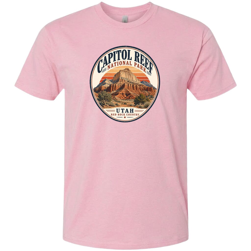 A pink t-shirt with a circular graphic design featuring the Capitol Reef National Park in Utah.