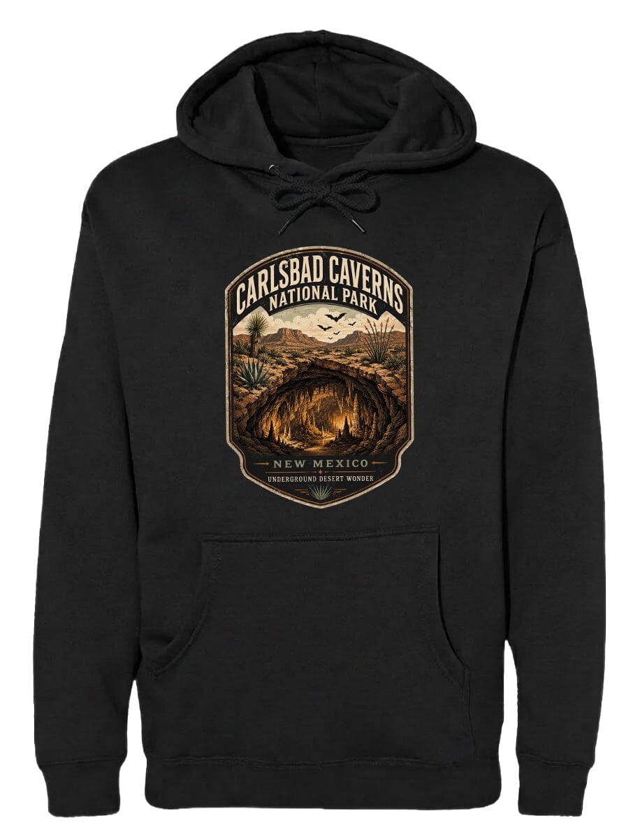 A black hoodie with a graphic design depicting the Carlsbad Caverns National Park in New Mexico, featuring a cave and desert landscape.