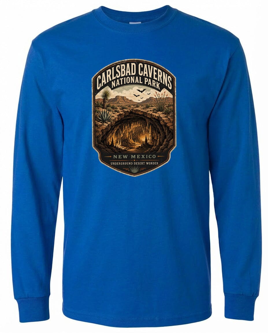 A blue long-sleeved t-shirt with a graphic design depicting the entrance to Carlsbad Caverns National Park in New Mexico.