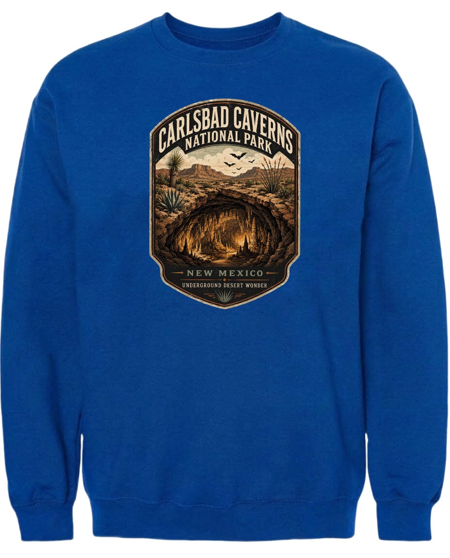 A blue sweatshirt with a graphic design depicting the Carlsbad Caverns National Park in New Mexico.