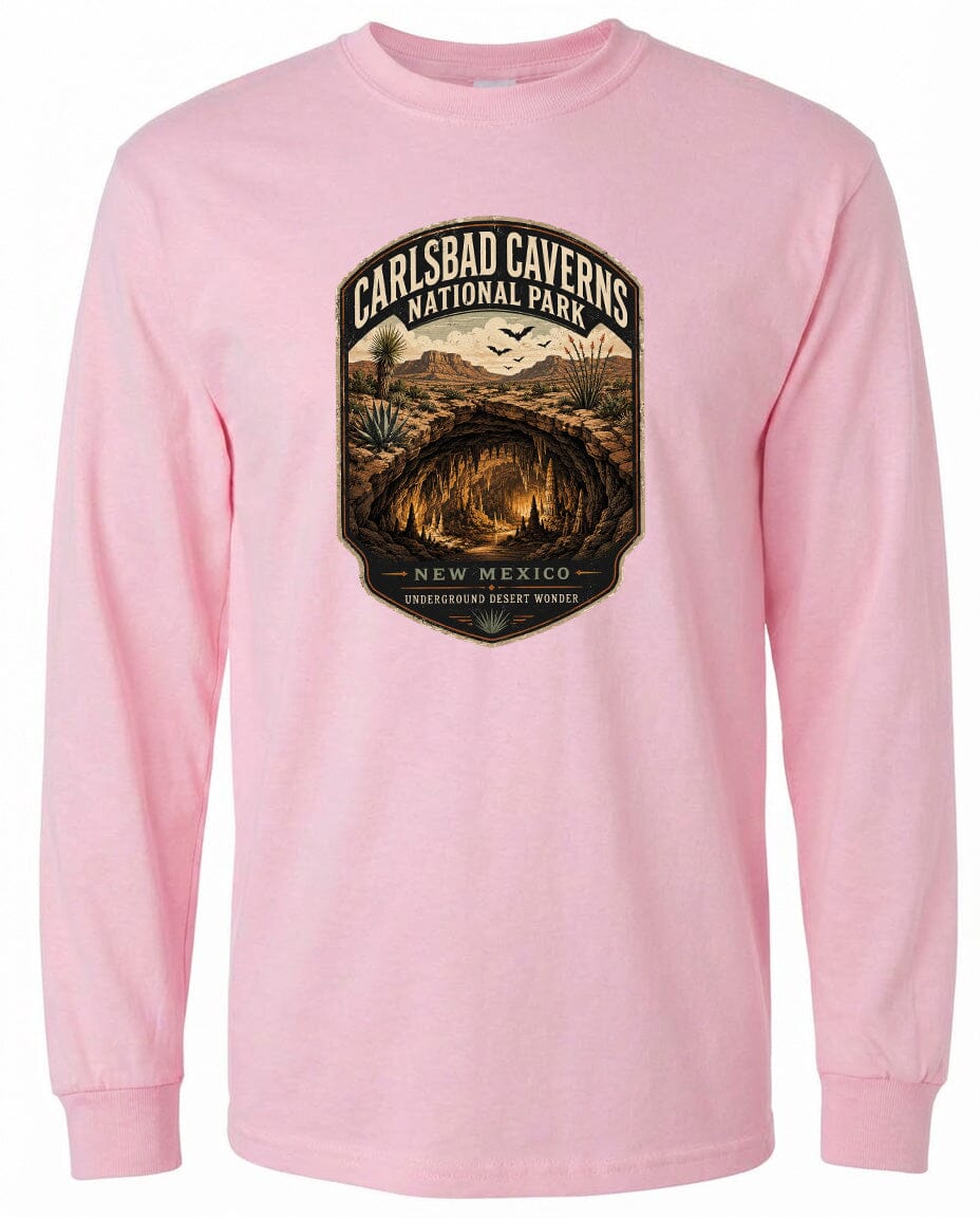 A pink long-sleeved t-shirt with a graphic design depicting the Carlsbad Caverns National Park in New Mexico.
