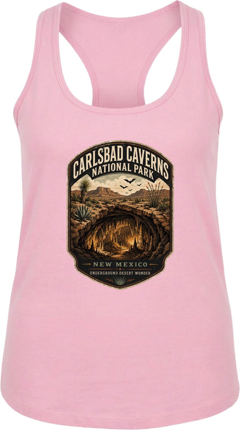 A pink tank top with a graphic design depicting the Carlsbad Caverns National Park in New Mexico, featuring a desert landscape with a cave and birds in the sky.