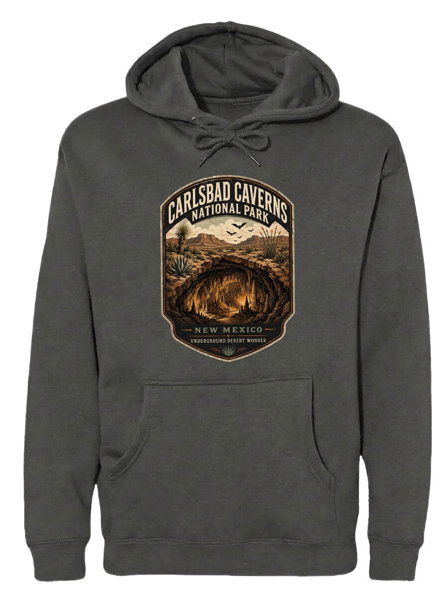 A hooded sweatshirt with a graphic design featuring the name of a national park, the phrase "CARLSBAD CAVENS NATIONAL PARK", and the location "NEW MEXICO, UNDERGROUND DEEP WONDERS".