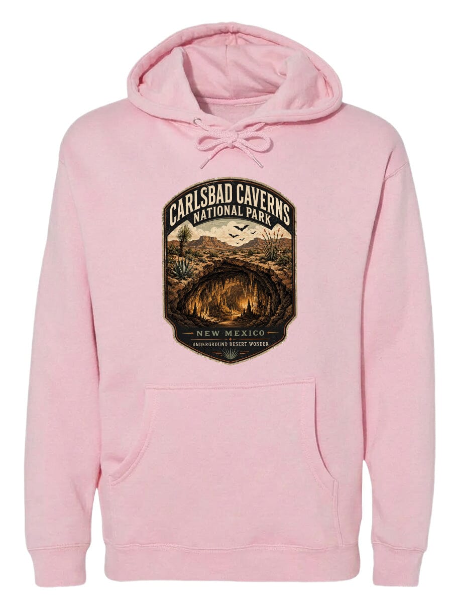 A pink hoodie with a graphic design depicting the Carlsbad Caverns National Park in New Mexico.