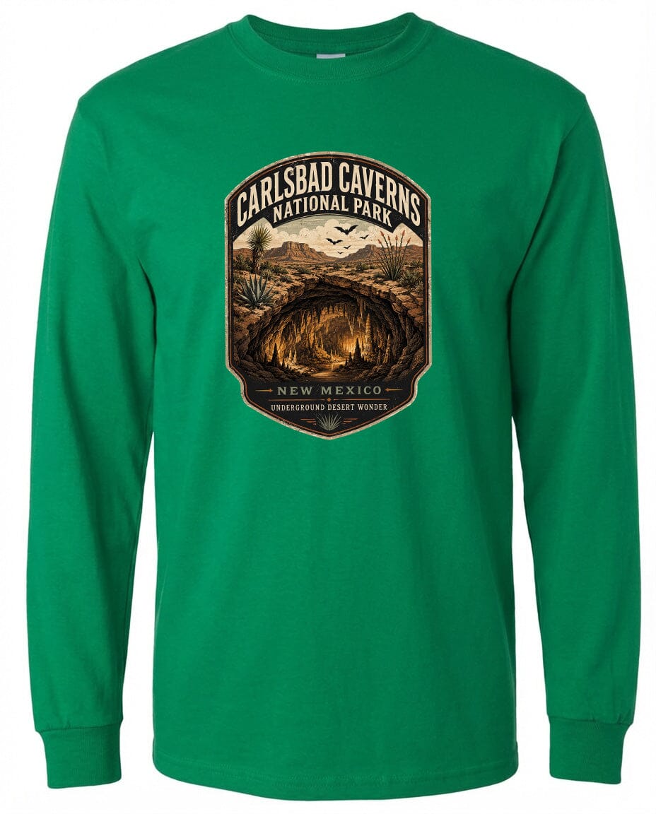 A green long-sleeved t-shirt with a graphic design depicting the entrance to Carlsbad Caverns National Park in New Mexico.