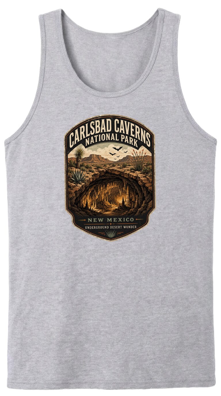 A gray tank top with a graphic design depicting the Carlsbad Caves National Park in New Mexico, featuring a desert landscape with a cave system and the text "CARLSBAD CAVENS NATIONAL PARK" and "UNDERGROUND DESERT WONDER".