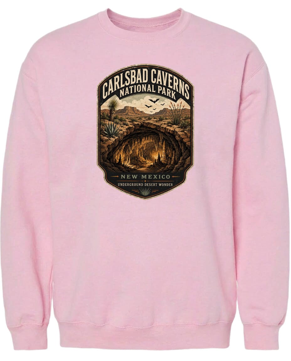 A pink sweatshirt with a graphic design depicting the Carlsbad Caverns National Park in New Mexico.