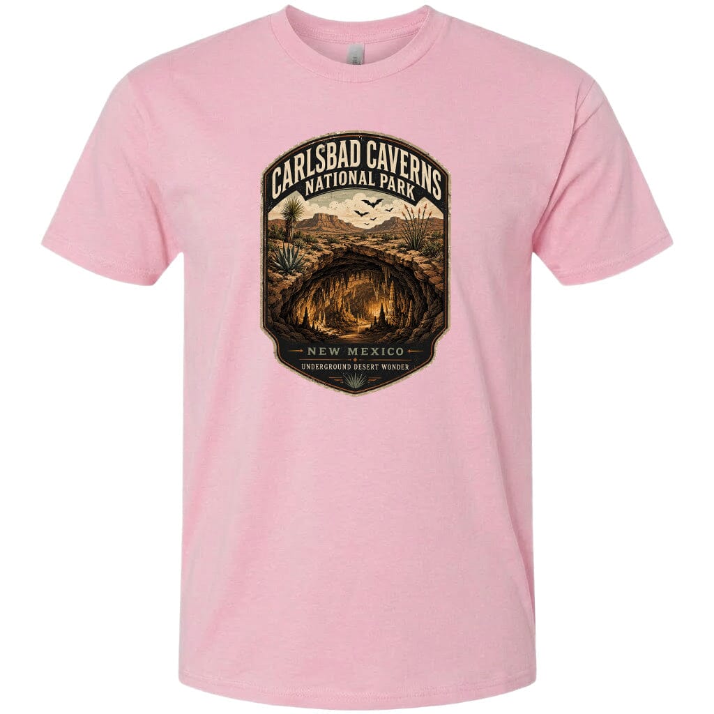A pink t-shirt with a graphic design depicting the Carlsbad Caves National Park in New Mexico.