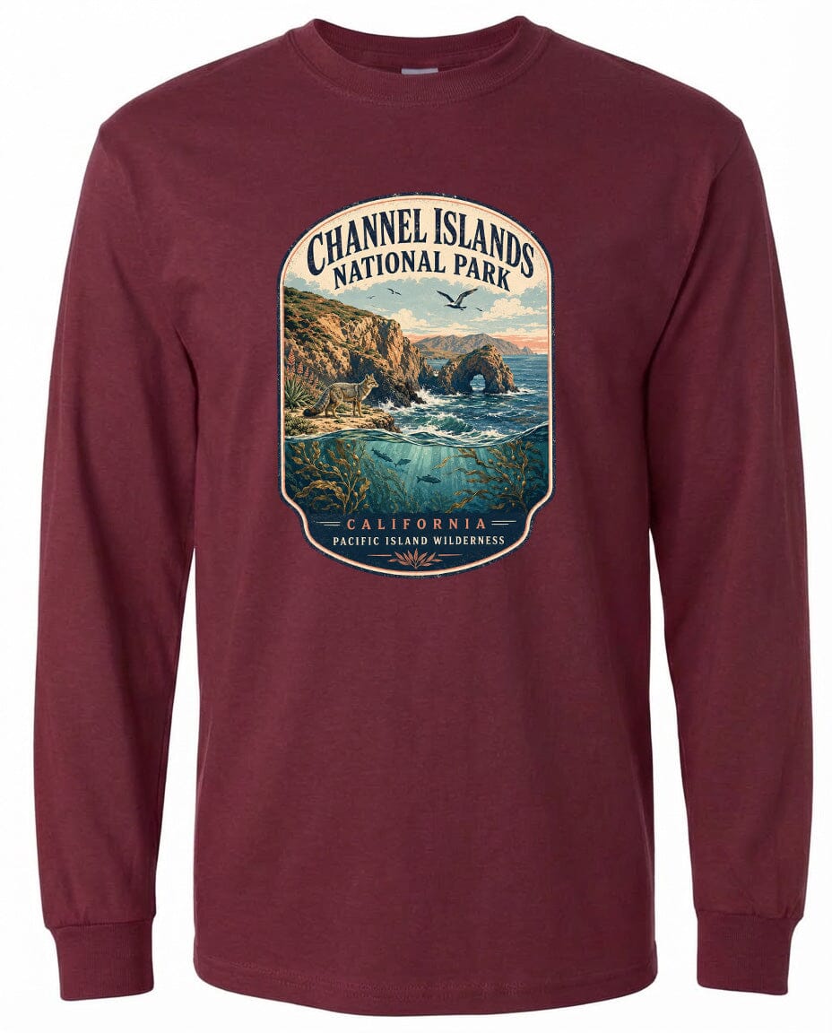 A long-sleeved burgundy t-shirt with a graphic design depicting a scenic landscape featuring a coastal area, mountains, and a body of water.