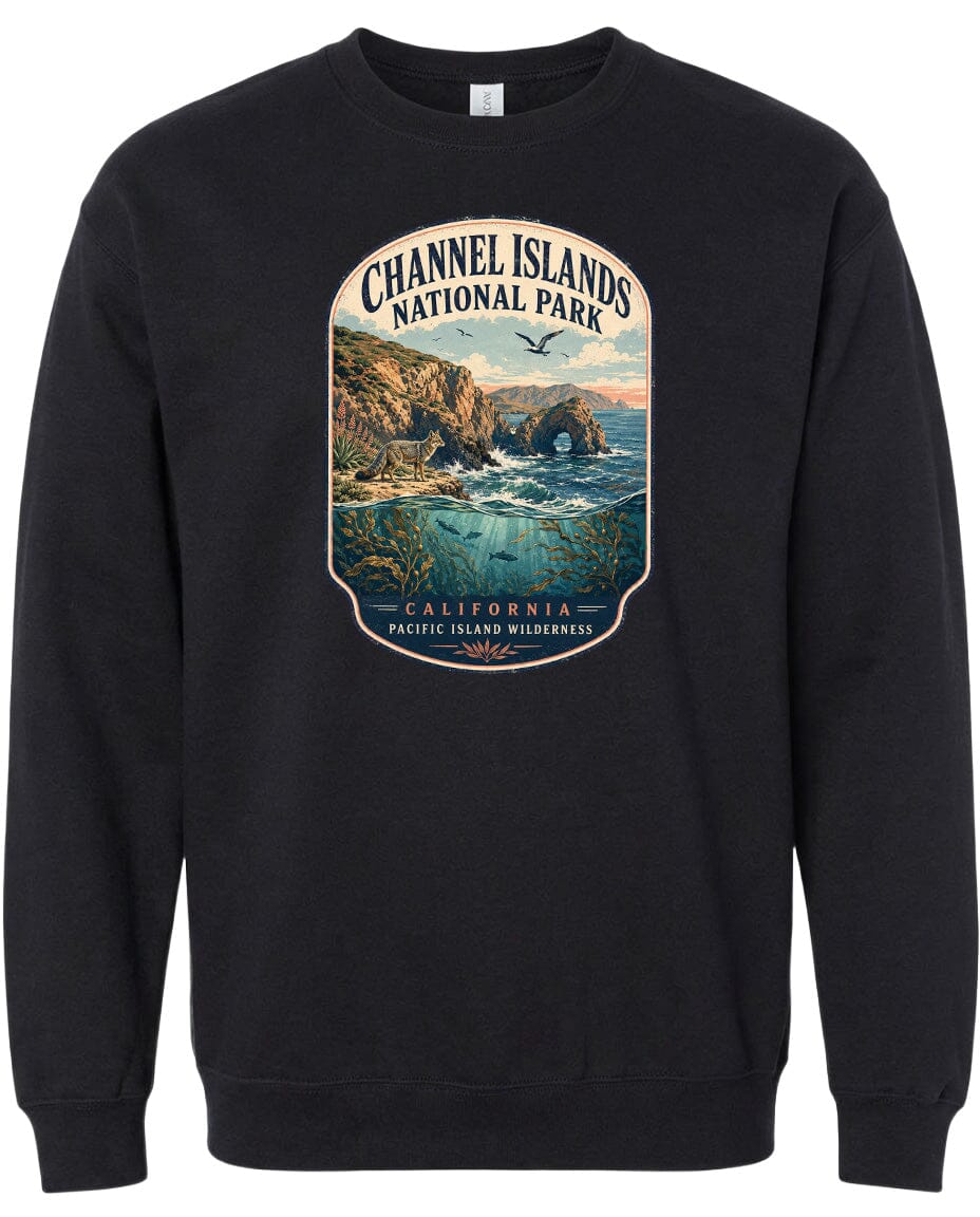A black sweatshirt with a graphic design depicting a scenic landscape featuring cliffs, water, and a bird in flight.
