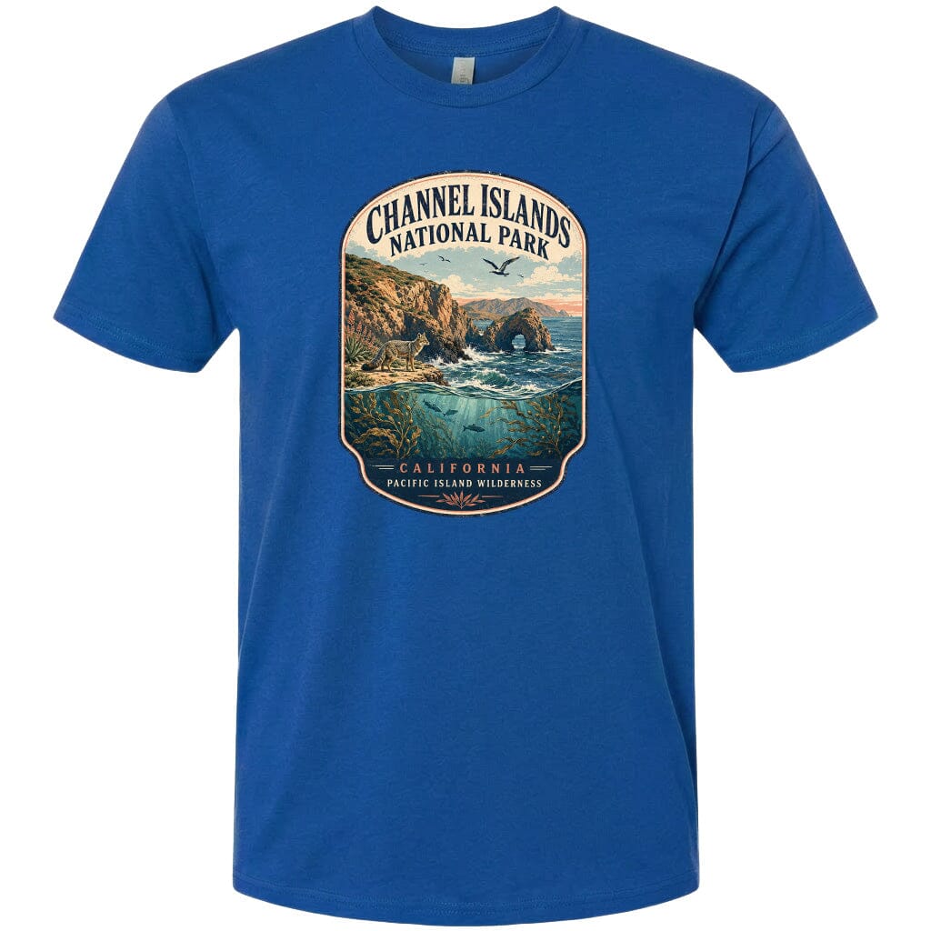 A blue t-shirt with a graphic design depicting a scenic coastal landscape with cliffs, water, and wildlife.