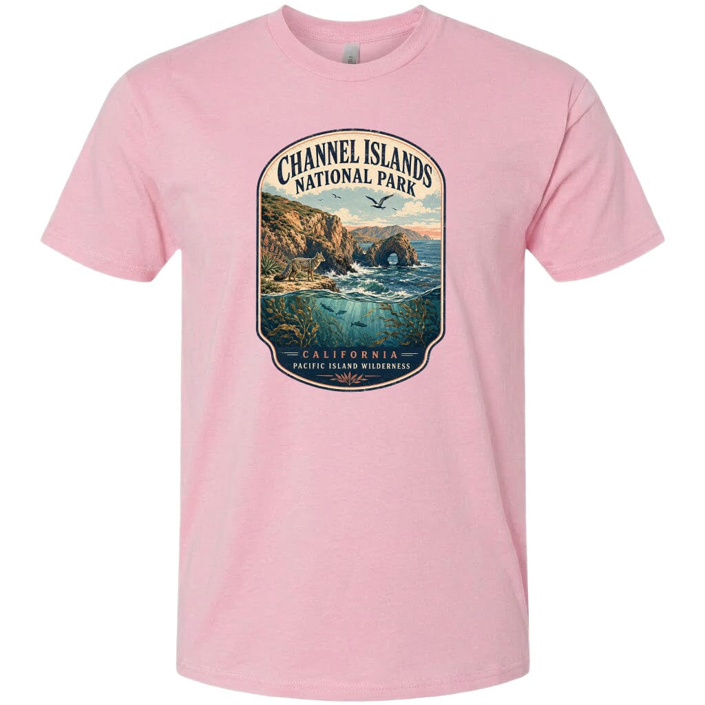 A pink t-shirt with a graphic design depicting a scenic coastal landscape with cliffs, water, and wildlife.