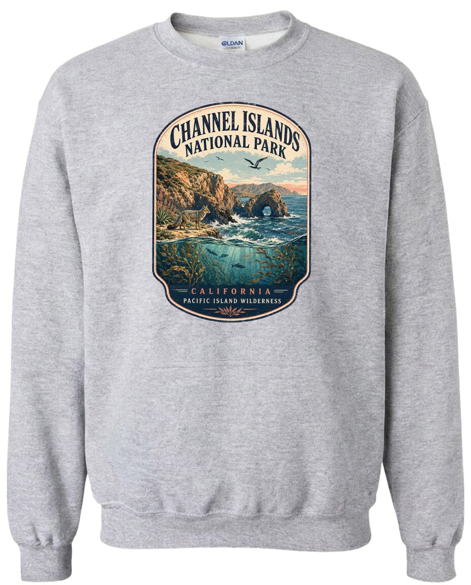 A gray sweatshirt with a graphic design depicting a scenic landscape featuring a rocky coastline, a bay, and a bird in flight.