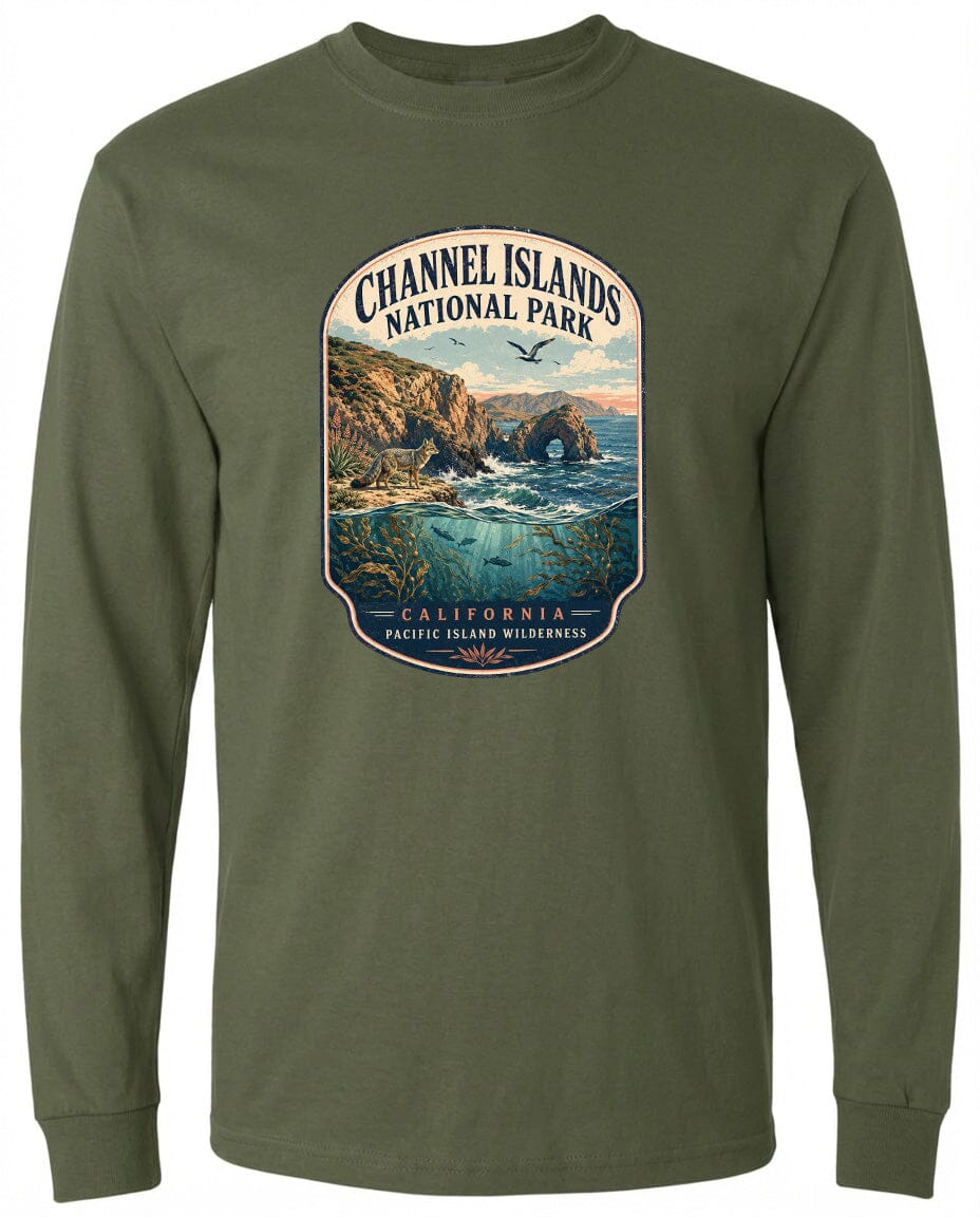 A graphic design on a long-sleeved green shirt depicting a scenic coastal landscape with cliffs, water, and a bird in flight.