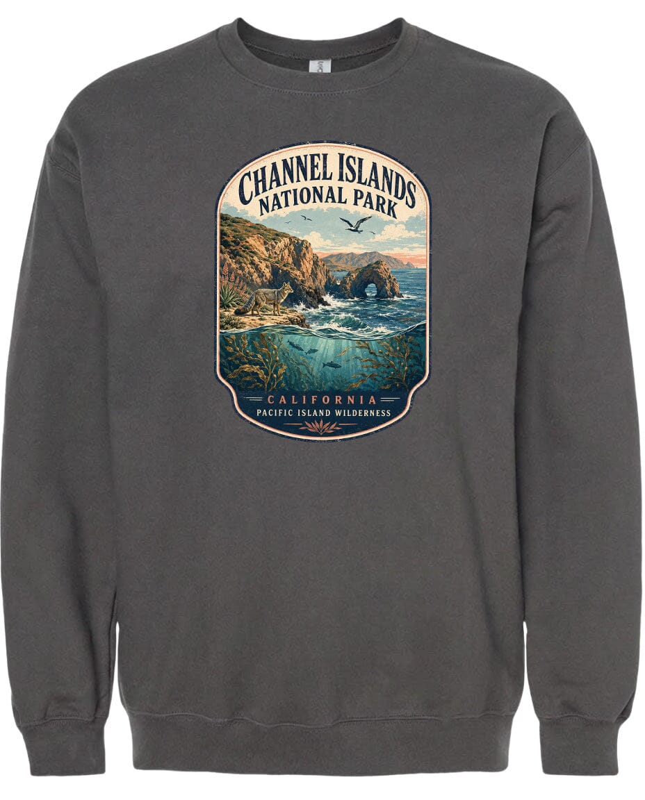 A gray sweatshirt with a graphic design depicting a scenic landscape with cliffs, water, and birds.