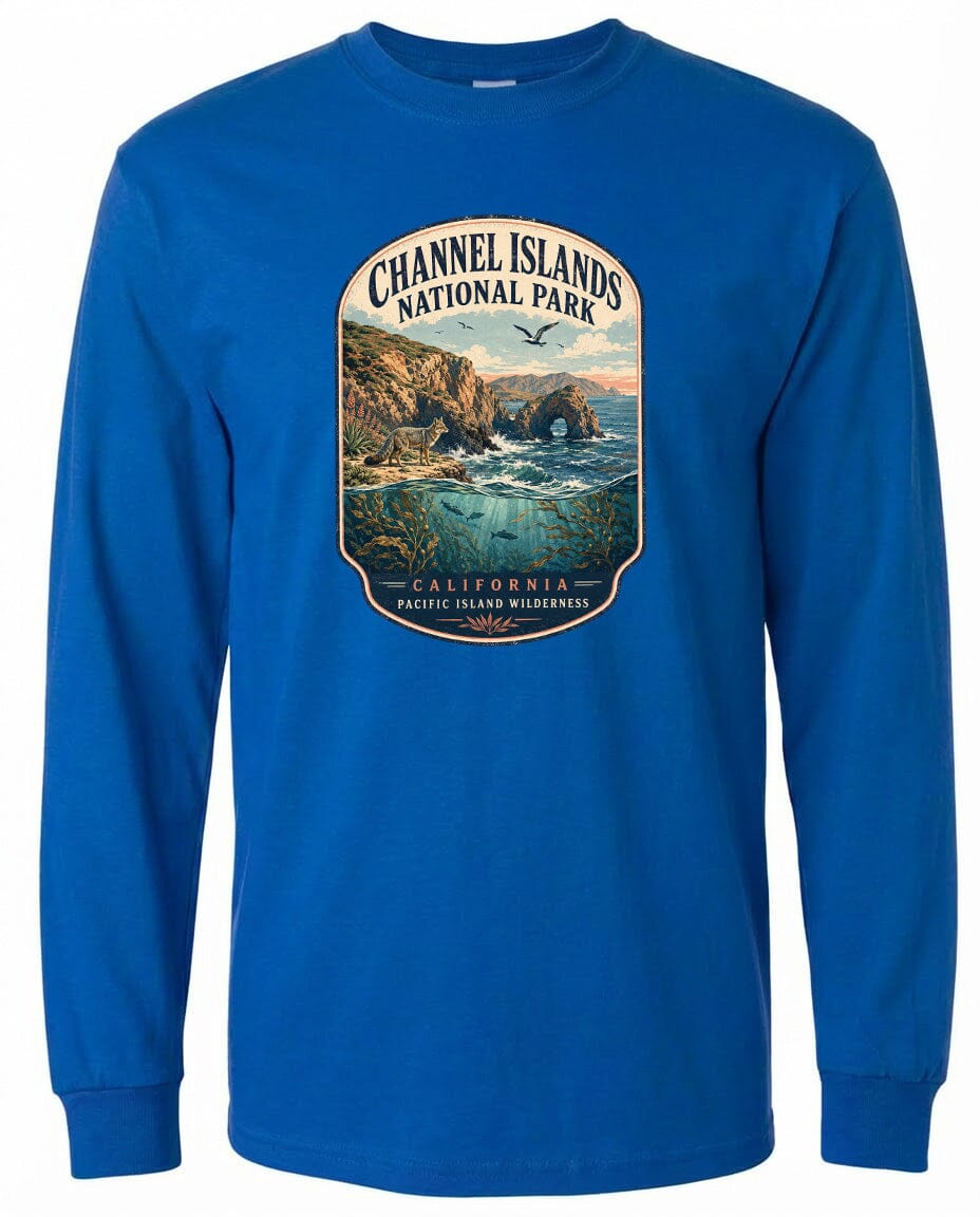 A blue long-sleeved t-shirt with a graphic design depicting a scenic landscape featuring a coastal area, mountains, and a body of water.