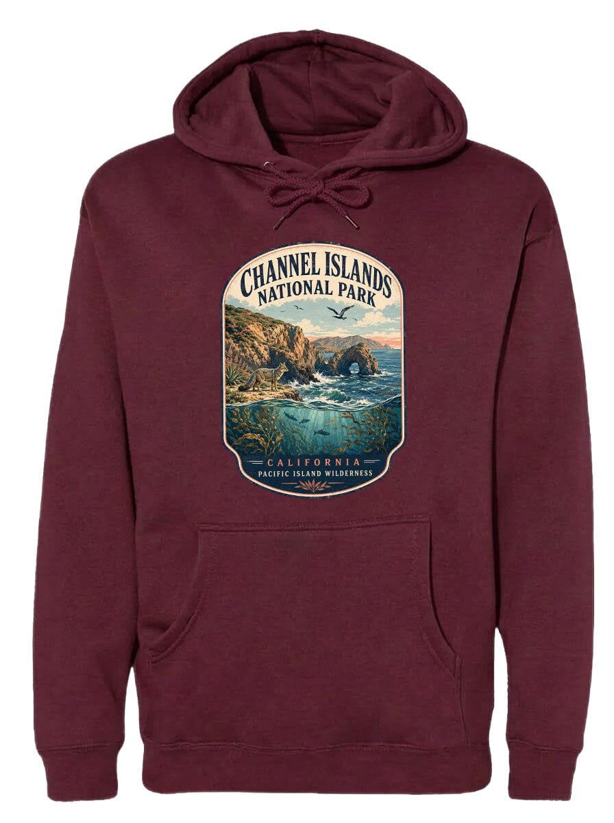 A maroon hoodie with a graphic design depicting a scenic landscape, including a coastal area with cliffs, water, and a bird in flight.