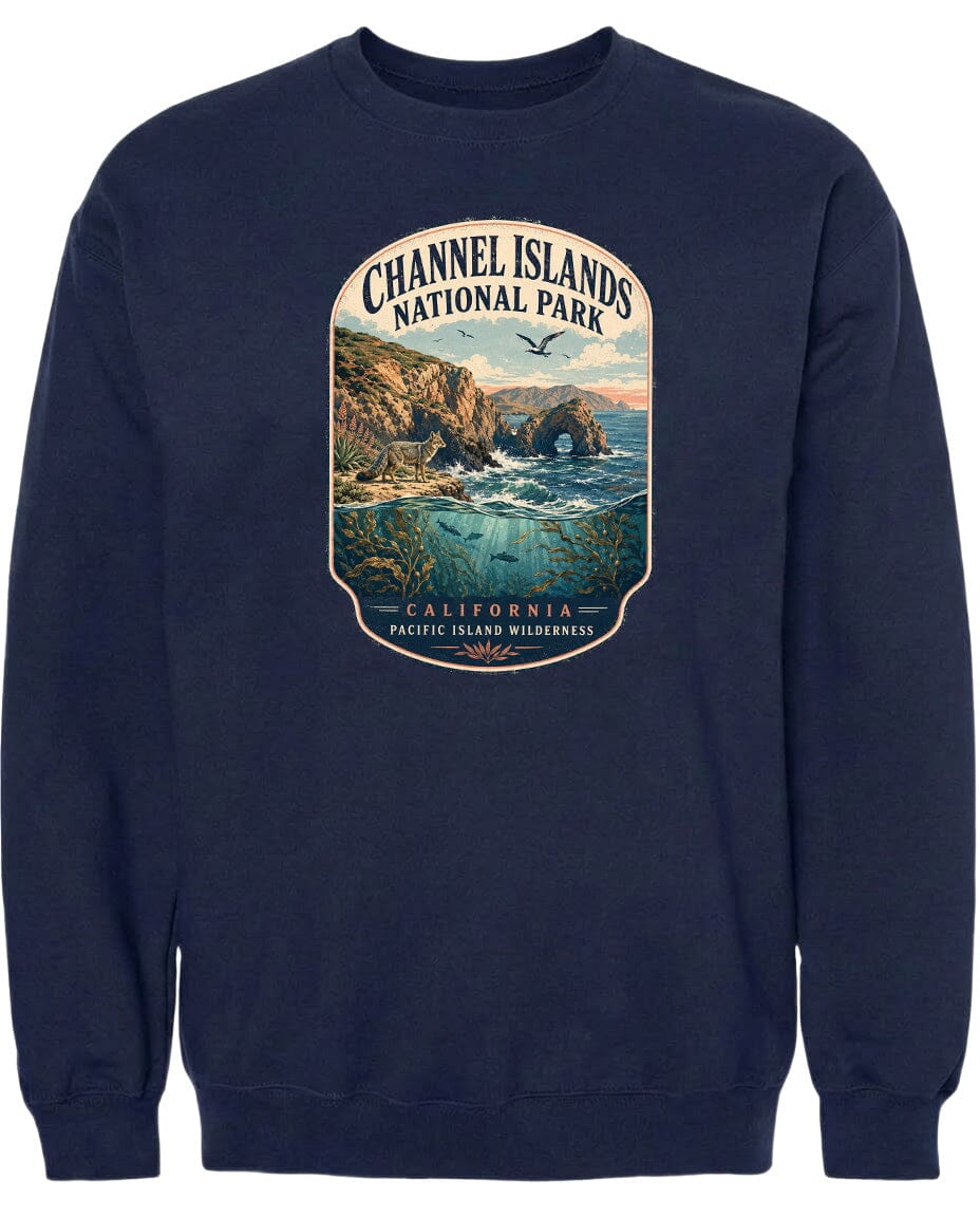 A navy blue sweatshirt with a graphic design depicting a scenic coastal landscape with cliffs, water, and birds.
