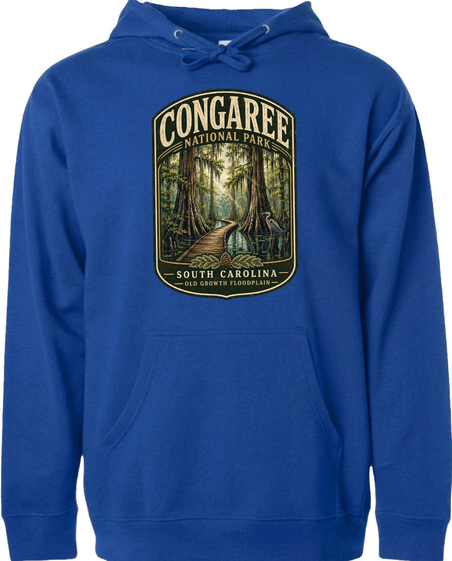 A blue hoodie with a graphic design depicting a forest path leading through Congaree National Park in South Carolina.