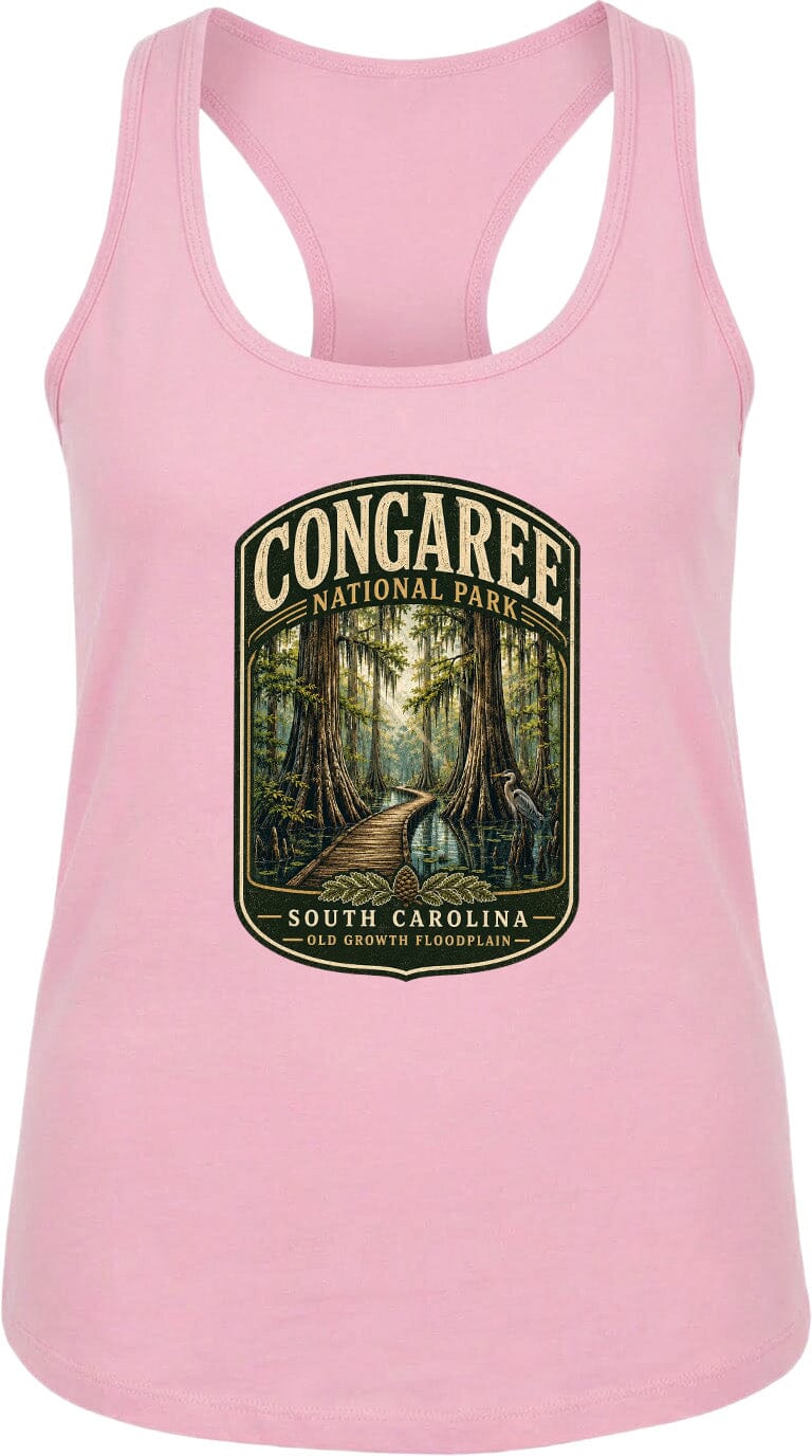 A pink tank top with a graphic design depicting a forest scene and a path leading through it, along with the text "CONGAREE NATIONAL PARK SOUTH CAROLINA OLD GROWTH FLOODPLAIN".