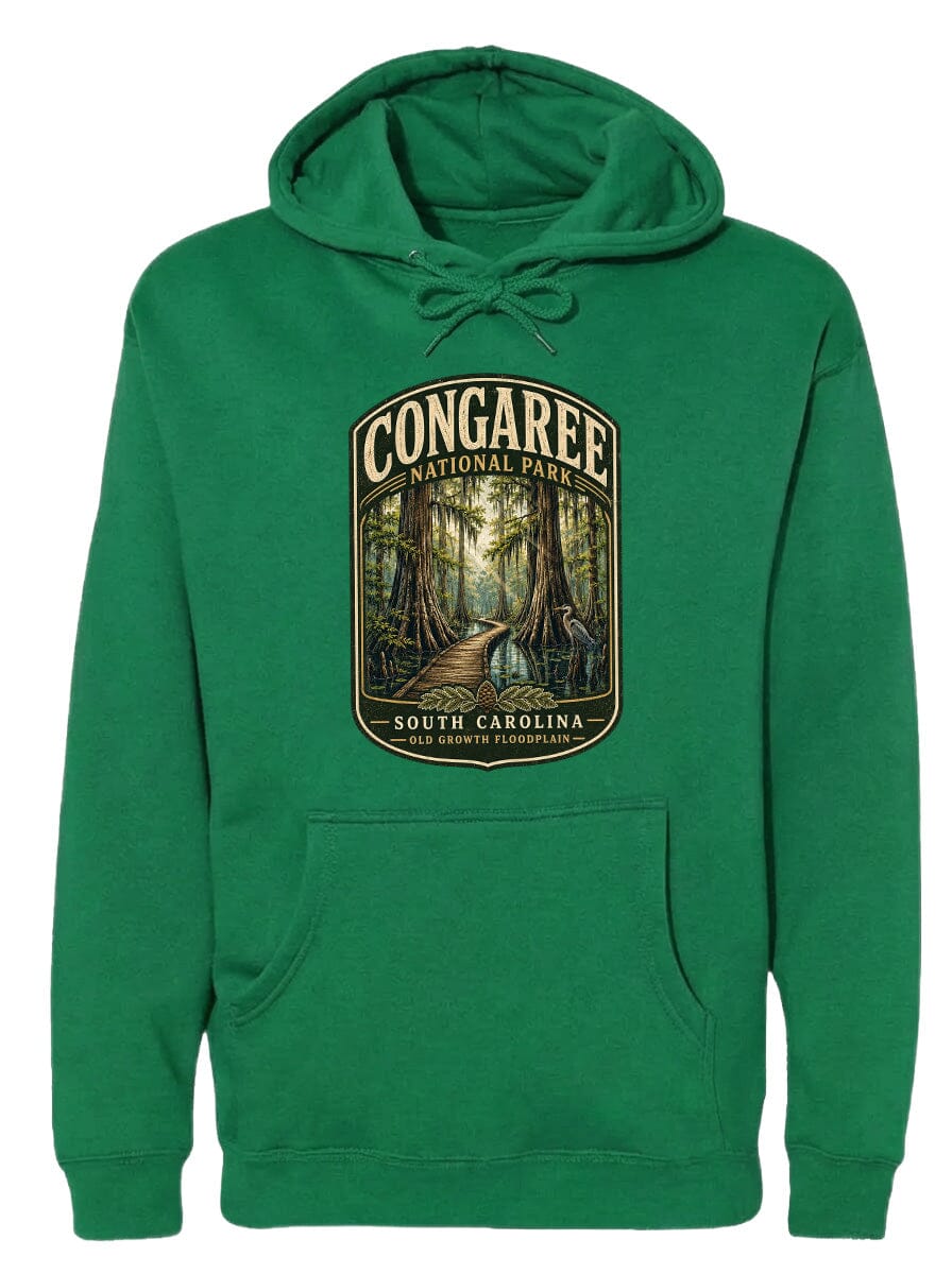 A green hoodie with a graphic design depicting a forest scene and text that says "CONGAREE NATIONAL PARK SOUTH CAROLINA".