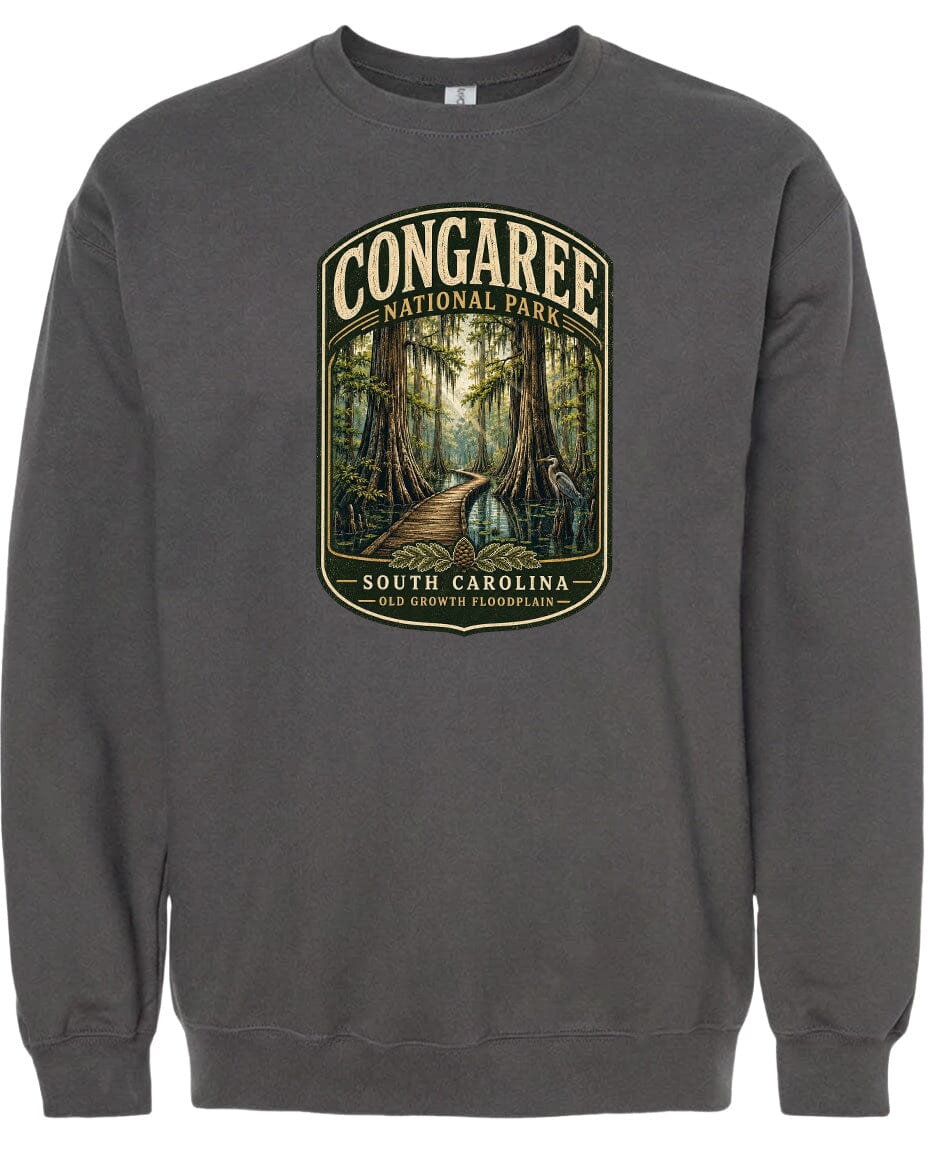 A gray sweatshirt with a graphic design depicting a forest scene with a path leading through it, surrounded by trees and foliage.
