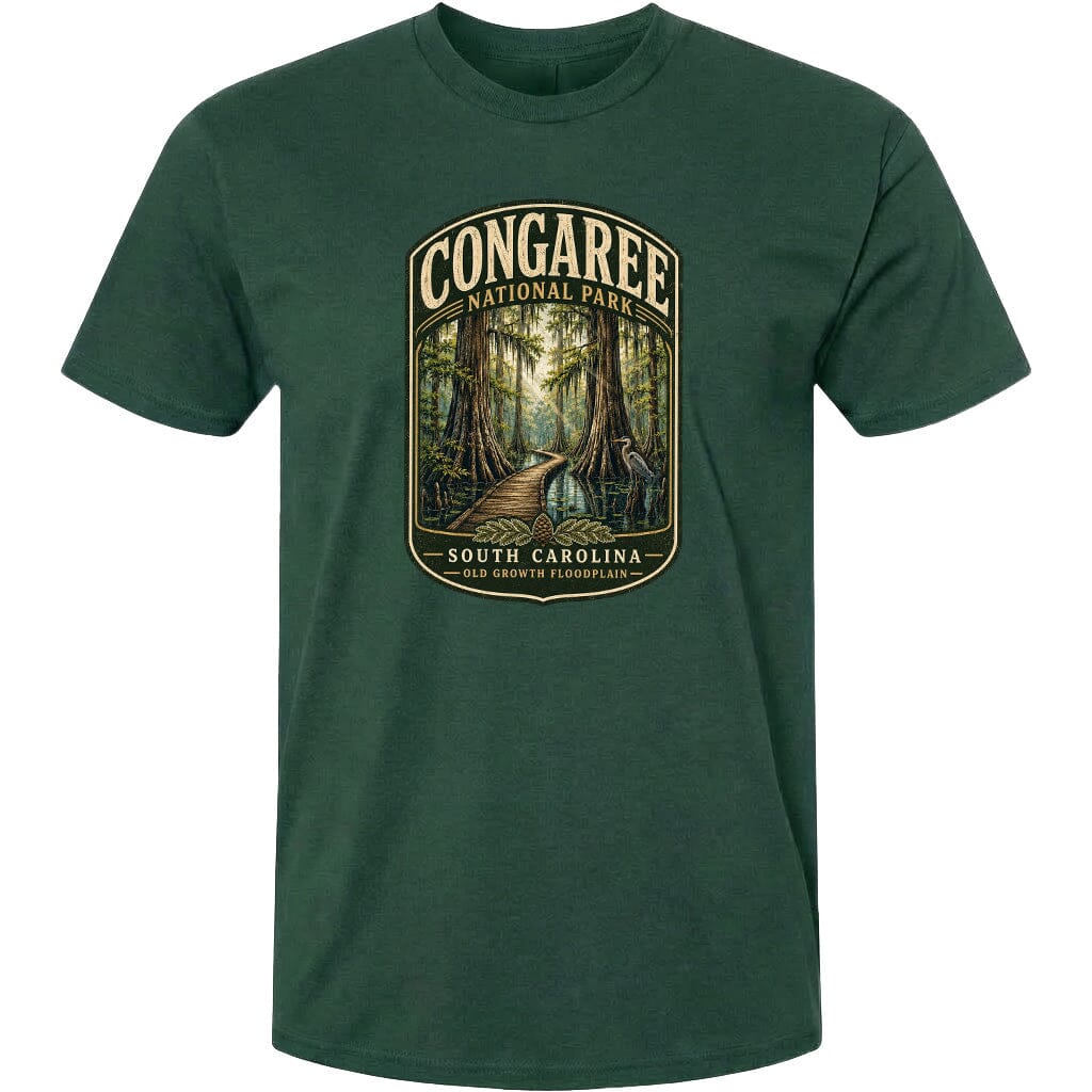 A green t-shirt with a graphic design depicting a forest scene with a path leading through it, surrounded by trees and foliage.