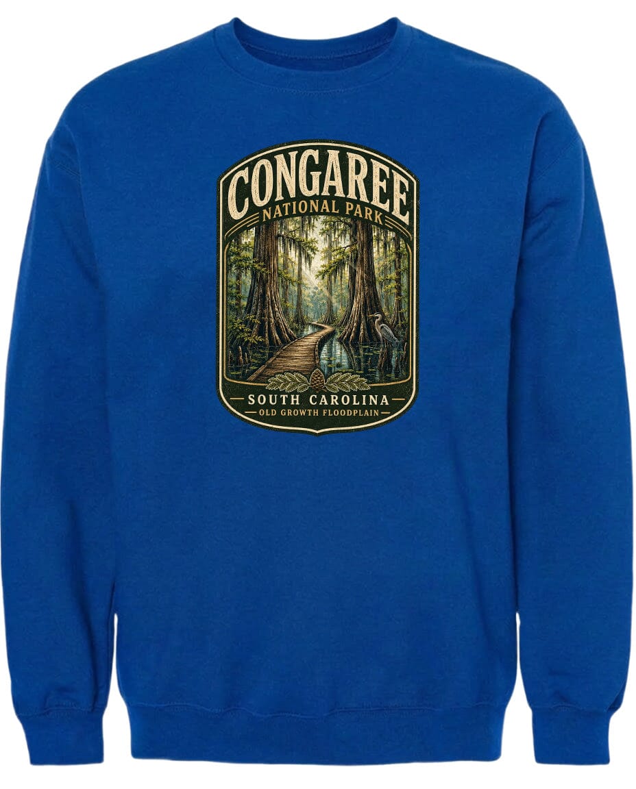A blue sweatshirt with a graphic design depicting a forest scene with a path leading through it.