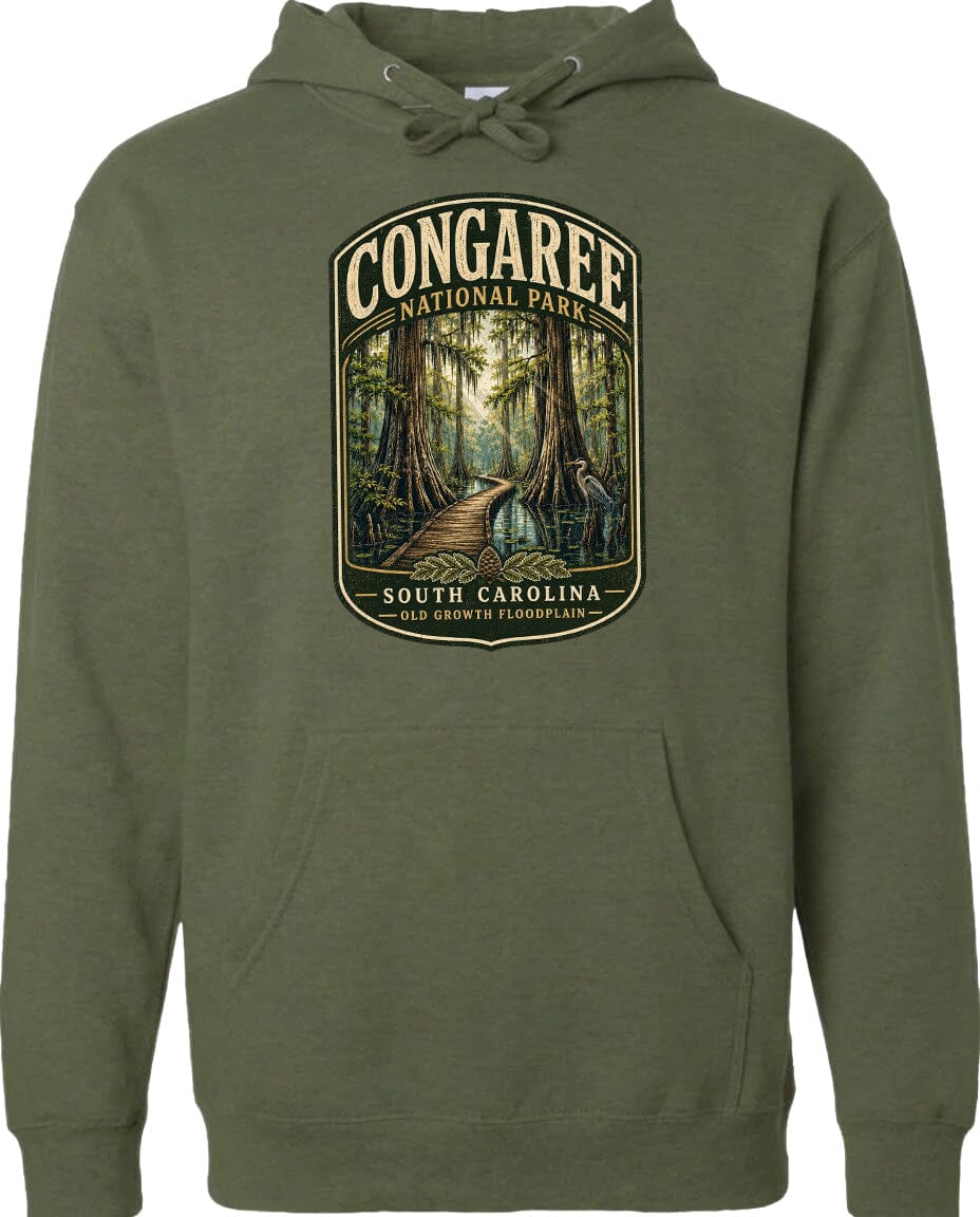 A green hoodie with a graphic design depicting a forest path leading through Congaree National Park in South Carolina.