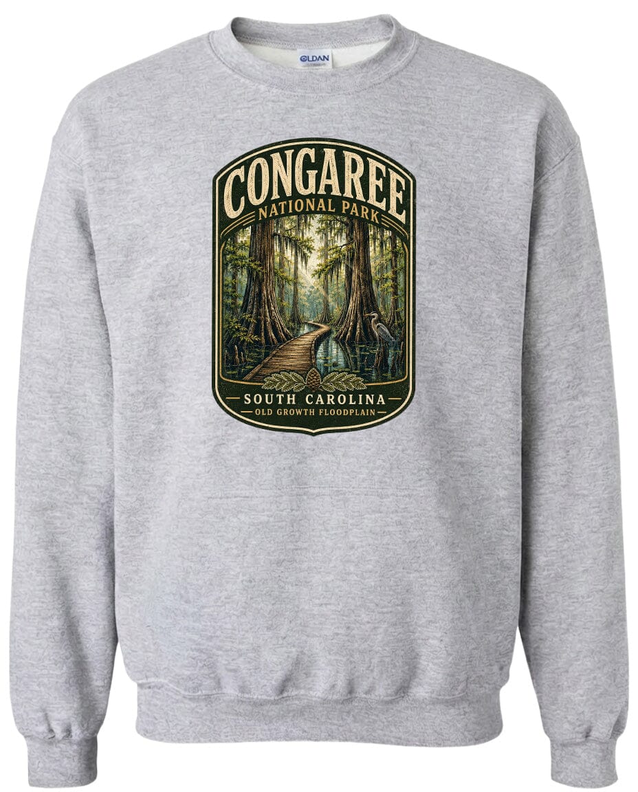 A gray sweatshirt with a graphic design depicting a forest scene with a path leading through it, surrounded by trees and foliage.