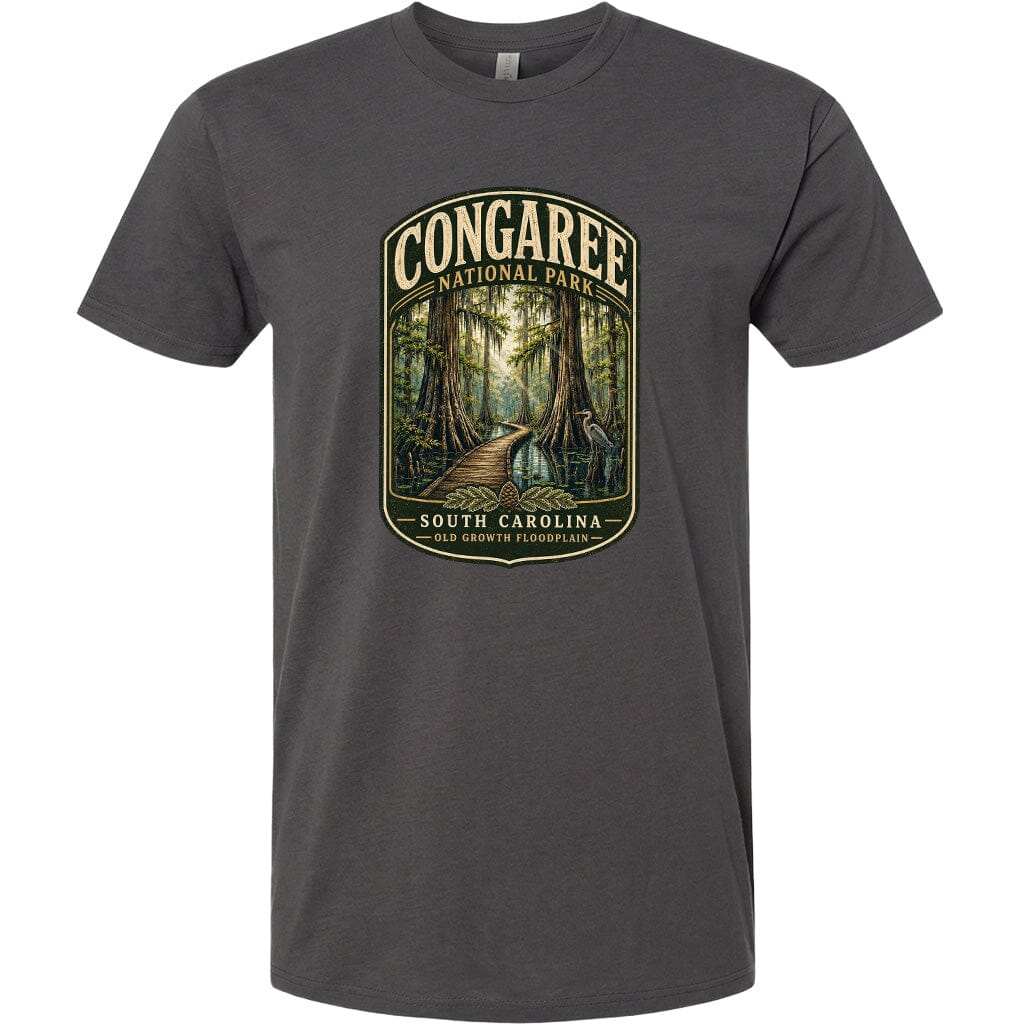 A gray t-shirt with a graphic design depicting a forest scene with a path leading through it, surrounded by trees and foliage.