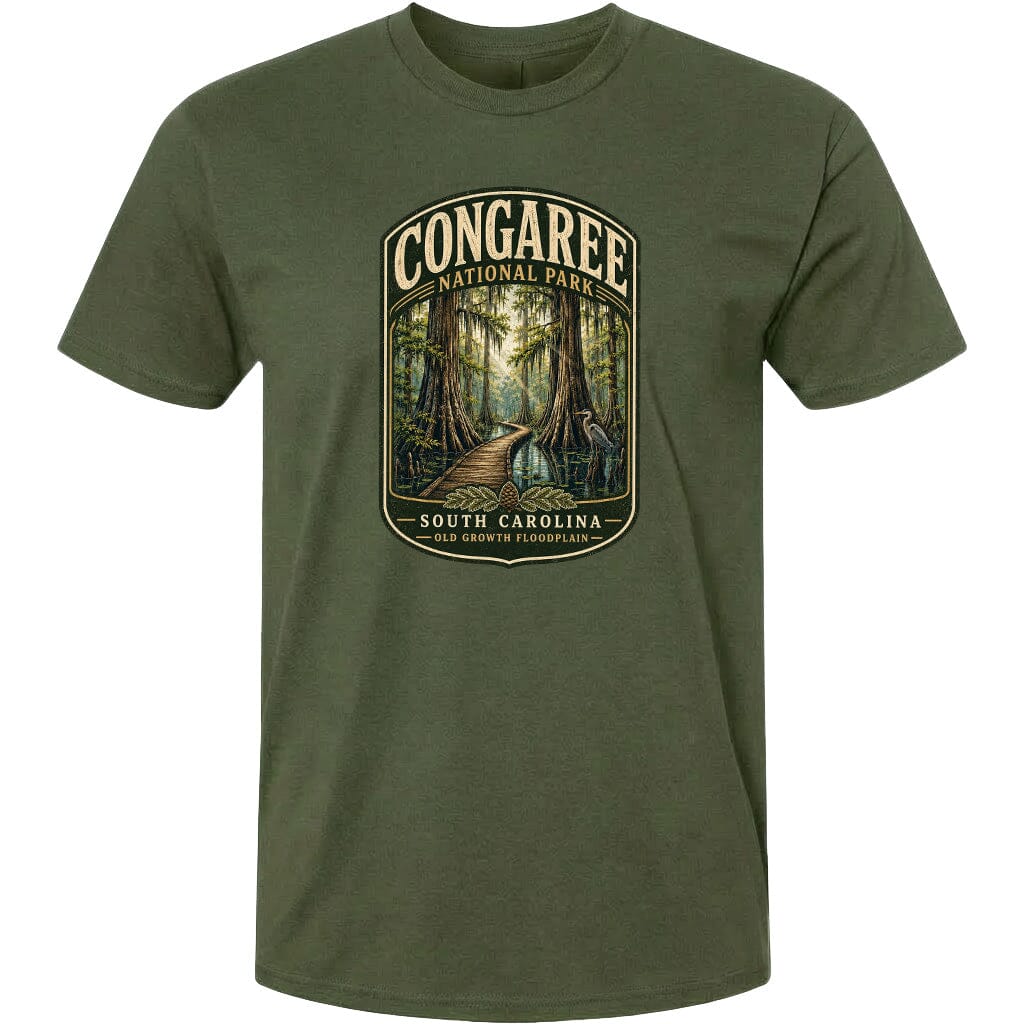 A green t-shirt with a graphic design depicting a forest scene with a path leading through it, surrounded by trees and foliage.
