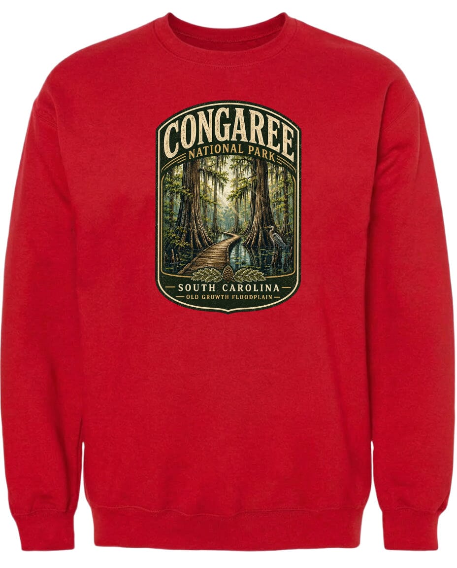 A red sweatshirt with a graphic design depicting a forest scene with a path leading through it.