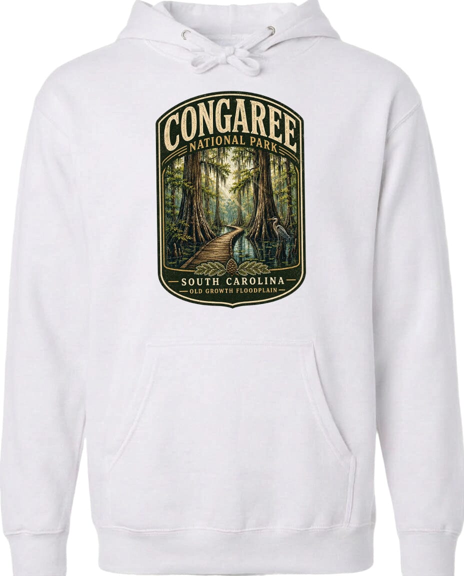 A white hoodie with a graphic design depicting a forest path leading through Congaree National Park in South Carolina.